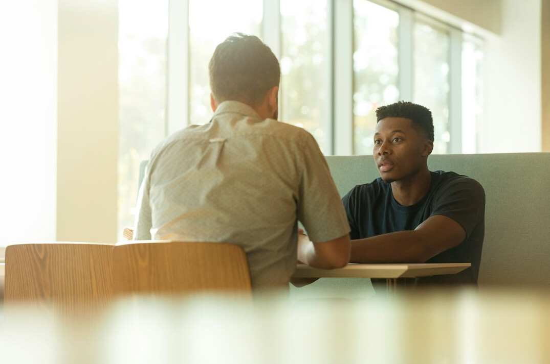 person in conversation