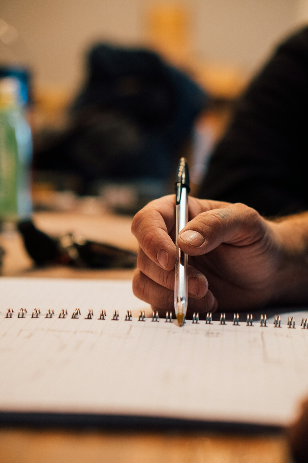 person planning goals on paper