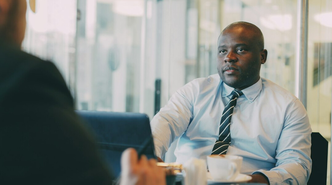 person in conversation