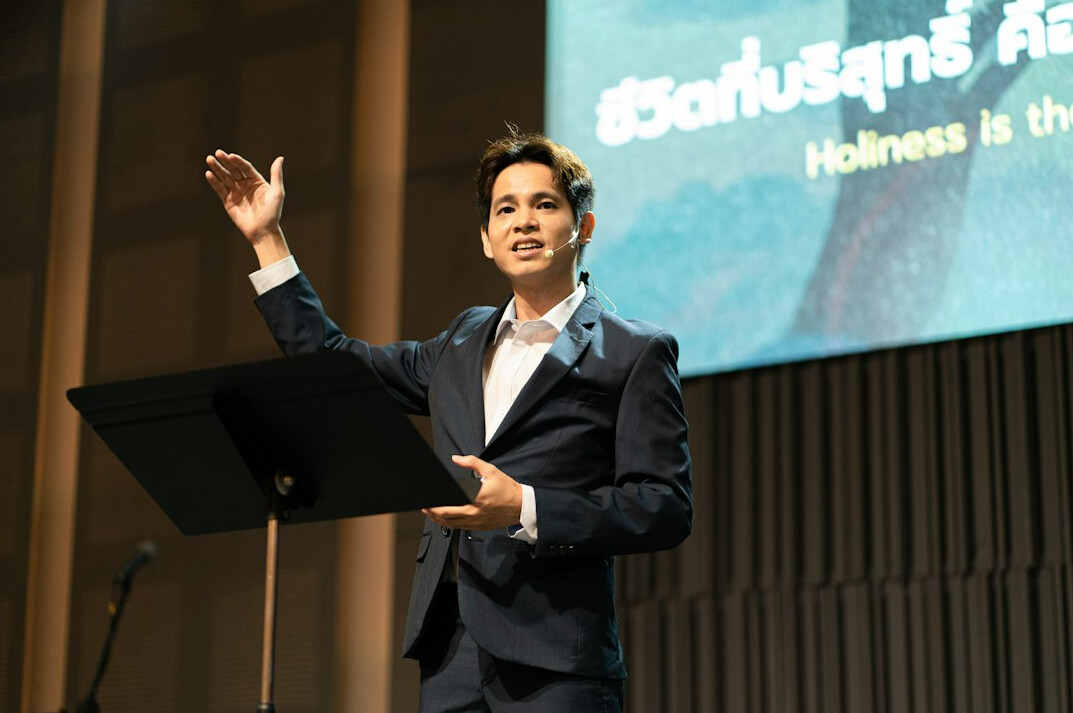 confident speaker on podium