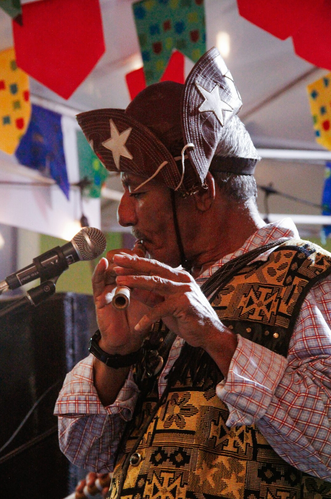 Brazilian man speaking to an audience in a bright room